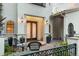 Charming front entrance with double doors, landscaped patio and cozy seating at 4525 King St, Denver, CO 80211