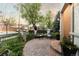 Inviting front patio with a paved surface, wrought iron fence and lush landscaping at 4525 King St, Denver, CO 80211