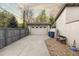Detached garage with concrete driveway, privacy fence and space for parking and storage at 4525 King St, Denver, CO 80211