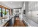 Bright kitchen boasts marble countertops, stainless steel appliances, and an inviting eat-in island at 4525 King St, Denver, CO 80211