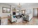 Living room featuring stone fireplace, neutral decor, stone floors, and ample natural light at 4525 King St, Denver, CO 80211