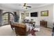 Bright home office with a ceiling fan, TV, rustic wood trim, balcony doors and comfortable seating at 4525 King St, Denver, CO 80211