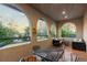 Covered patio area with wrought iron railings, comfortable furniture, and relaxing atmosphere at 4525 King St, Denver, CO 80211
