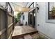 Private side yard featuring a wooden deck, garden beds and a shade sail at 4525 King St, Denver, CO 80211