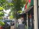 Bustling street view with shops and restaurants under tree-lined sidewalks at 4525 King St, Denver, CO 80211