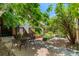 Serene backyard oasis with lush greenery, a patio area, and a tranquil garden setting at 1243 N Lafayette St, Denver, CO 80218