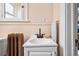 Bathroom featuring a white vanity, black fixtures, and unique vintage radiator at 1243 N Lafayette St, Denver, CO 80218