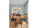 Bright dining room with hardwood floors, modern lighting, and seamless flow into the cozy living room at 1243 N Lafayette St, Denver, CO 80218