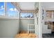 Bright entryway featuring hardwood floors, a large window, and access to the living space at 1243 N Lafayette St, Denver, CO 80218