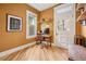 Cozy home office with a window view, custom shelving, and hardwood flooring at 1243 N Lafayette St, Denver, CO 80218