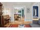 Open-concept living space with hardwood floors flowing into dining area and kitchen, showcasing a warm and inviting atmosphere at 1243 N Lafayette St, Denver, CO 80218