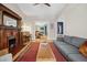 Warm living room with a fireplace, piano, and a comfortable seating area under a ceiling fan at 1243 N Lafayette St, Denver, CO 80218