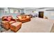 Basement featuring a leather sofa set, rec equipment, and a play area at 11209 Quivas Loop, Denver, CO 80234