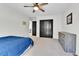 Bright bedroom featuring a dark closet and a gray dresser for storage at 11209 Quivas Loop, Denver, CO 80234