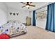 Bright bedroom with animal-themed bedding and decor, plus a window view at 11209 Quivas Loop, Denver, CO 80234