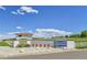 Welcoming entrance to The Ranch Country Club with manicured landscape and clear blue skies at 11209 Quivas Loop, Denver, CO 80234
