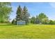 Scenic view of Ranch Park with open green space, tall trees, and walking path at 11209 Quivas Loop, Denver, CO 80234