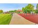 Community playground featuring swings, slides, and covered picnic area for families at 11209 Quivas Loop, Denver, CO 80234