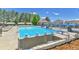 Community pool with diving boards, slide, and lounge chairs for residents' enjoyment at 11209 Quivas Loop, Denver, CO 80234