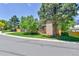 Two-story home with beautiful, green lawn and mature tree at 11209 Quivas Loop, Denver, CO 80234