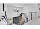 Stylish staircase featuring black metal railings and an open design at 11209 Quivas Loop, Denver, CO 80234