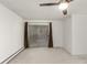 Bright bedroom featuring sliding glass doors to the balcony and neutral carpeting at 3450 S Poplar St # 109, Denver, CO 80224