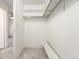 Walk-in closet featuring neutral carpeting and storage shelves at 3450 S Poplar St # 109, Denver, CO 80224