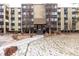 Inviting exterior of the complex with mature landscaping, sidewalks, and easy access at 3450 S Poplar St # 109, Denver, CO 80224