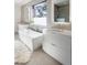 Modern bathroom with soaking tub and double sinks at 62 N Jasmine St, Denver, CO 80220