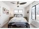 Cozy bedroom with window and ceiling fan at 62 N Jasmine St, Denver, CO 80220