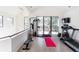 Home gym with a treadmill, weight machine and plenty of space at 62 N Jasmine St, Denver, CO 80220