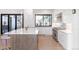 Modern kitchen with white cabinets and stainless steel appliances at 62 N Jasmine St, Denver, CO 80220