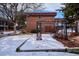 Courtyard with snow, arbor, and seating area at 10125 W 25Th Ave # 47, Lakewood, CO 80215