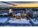 Aerial view of house and backyard in a snow covered neighborhood at 1867 Homestead Dr, Fort Lupton, CO 80621