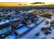 Aerial view of house and neighborhood near golf course at 1867 Homestead Dr, Fort Lupton, CO 80621