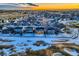 Aerial view of house and neighborhood near golf course at 1867 Homestead Dr, Fort Lupton, CO 80621