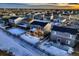 Aerial view of house and neighborhood during sunset in winter at 1867 Homestead Dr, Fort Lupton, CO 80621