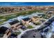 An aerial shot of a neighborhood featuring modern homes, green spaces, and well-planned streets under a partly cloudy sky at 1867 Homestead Dr, Fort Lupton, CO 80621