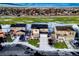 Aerial view of a neighborhood showcasing well-maintained homes, green spaces, and convenient street access in a serene setting at 1867 Homestead Dr, Fort Lupton, CO 80621