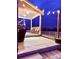 Evening view of backyard patio with string lights at 1867 Homestead Dr, Fort Lupton, CO 80621