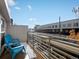 Balcony with two blue chairs and view of building at 4571 Stuart St, Denver, CO 80212