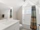 Bright bathroom with tub and shower combination, subway tile, and modern vanity at 4571 Stuart St, Denver, CO 80212