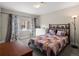 Bedroom with large window and unique headboard at 4571 Stuart St, Denver, CO 80212