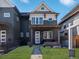 Inviting two-story home with a covered front porch and manicured lawn at 4571 Stuart St, Denver, CO 80212