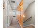Hallway with wood accent wall and view into bedroom at 4571 Stuart St, Denver, CO 80212