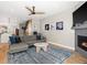 Cozy living room featuring a fireplace, hardwood floors, and comfortable seating at 4571 Stuart St, Denver, CO 80212