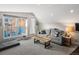 Cozy living area with a sofa, custom coffee table, and natural light from the windows at 4571 Stuart St, Denver, CO 80212