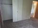 Bedroom boasts plush carpeting, neutral walls, and large closet space, perfect for comfortable living at 8353 Gaylord St, Denver, CO 80229