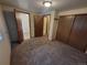 Spacious bedroom featuring neutral walls and multiple closets and entry ways at 8353 Gaylord St, Denver, CO 80229