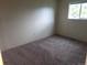 Bedroom with neutral colored walls and carpet with a window at 8353 Gaylord St, Denver, CO 80229